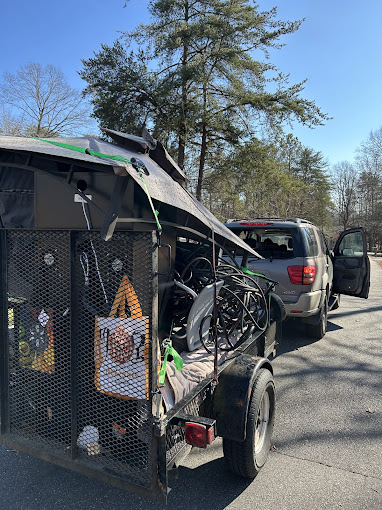 A truck with a bike on the back of it