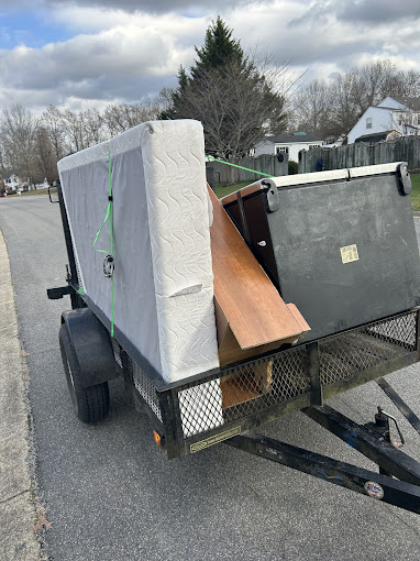 A trailer with a mattress on the back of it