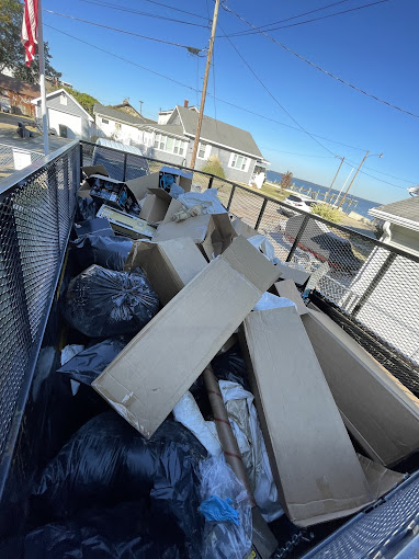 The back of a truck filled with lots of boxes