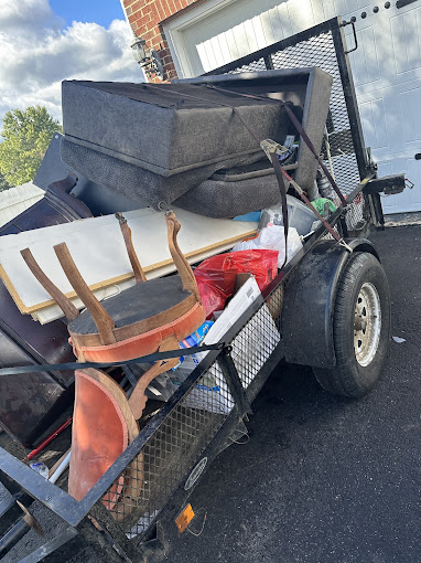 A trailer with a bunch of luggage in it